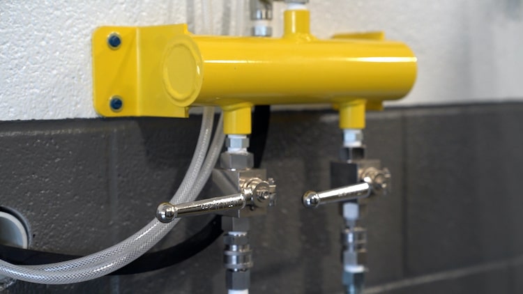 Enzo's undercarriage wash system installed in a fleet wash bay